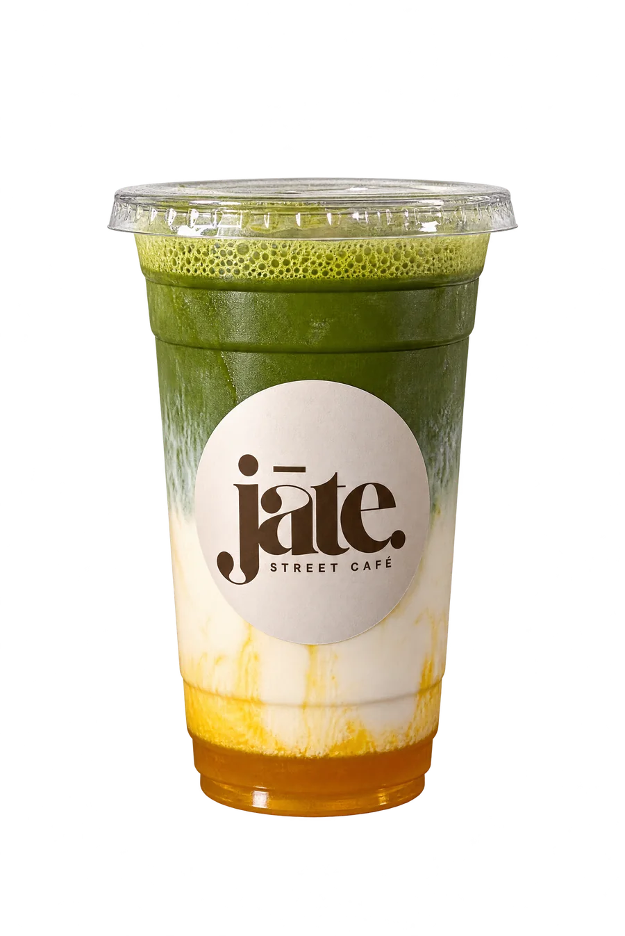 Matcha latte mangue jāte : couches de matcha vert, de lait et de purée de mangue